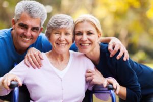 portrait of mid age couple and senior mother outdoors