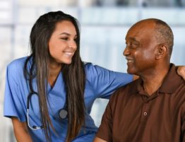 medicare - Health care worker helping an elderly patient